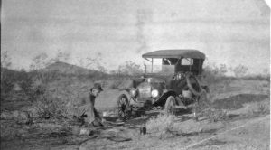 Paul R Maxey trip from CA, cooking on a fire in front of the car